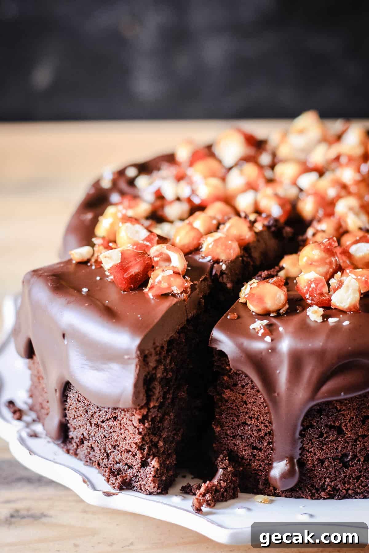 Decadent Chocolate Hazelnut Cake on a plate with a slice cut