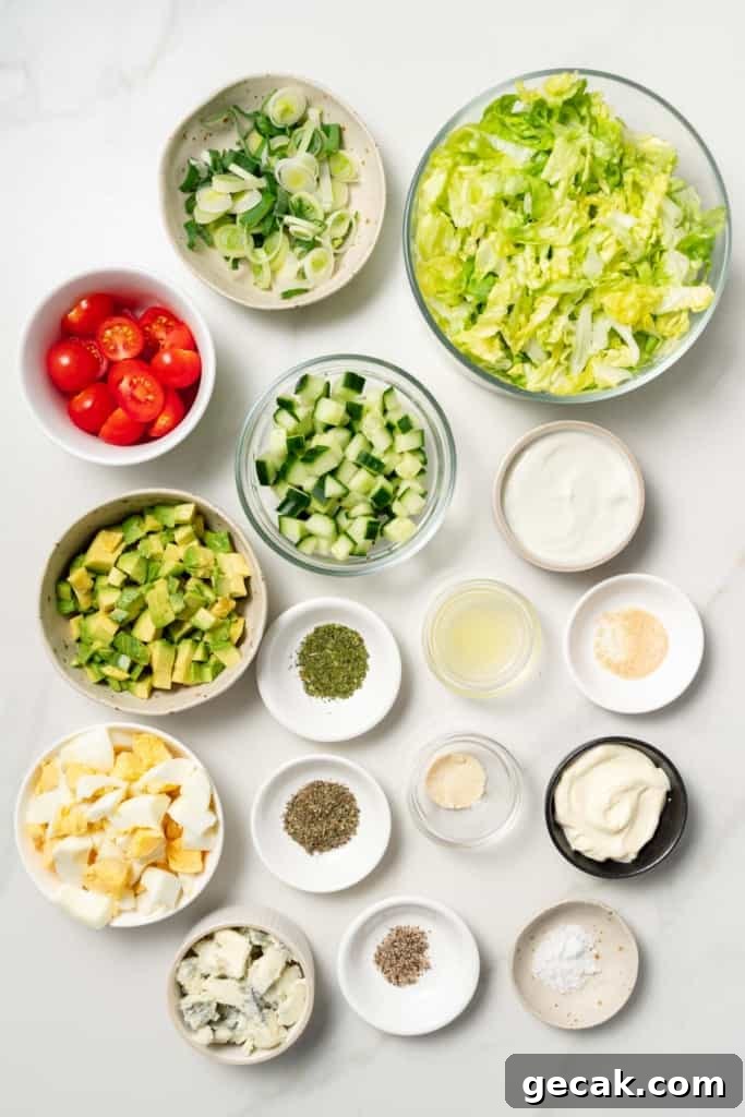 Ingredients for making a vegetarian cobb salad divided into small bowls.