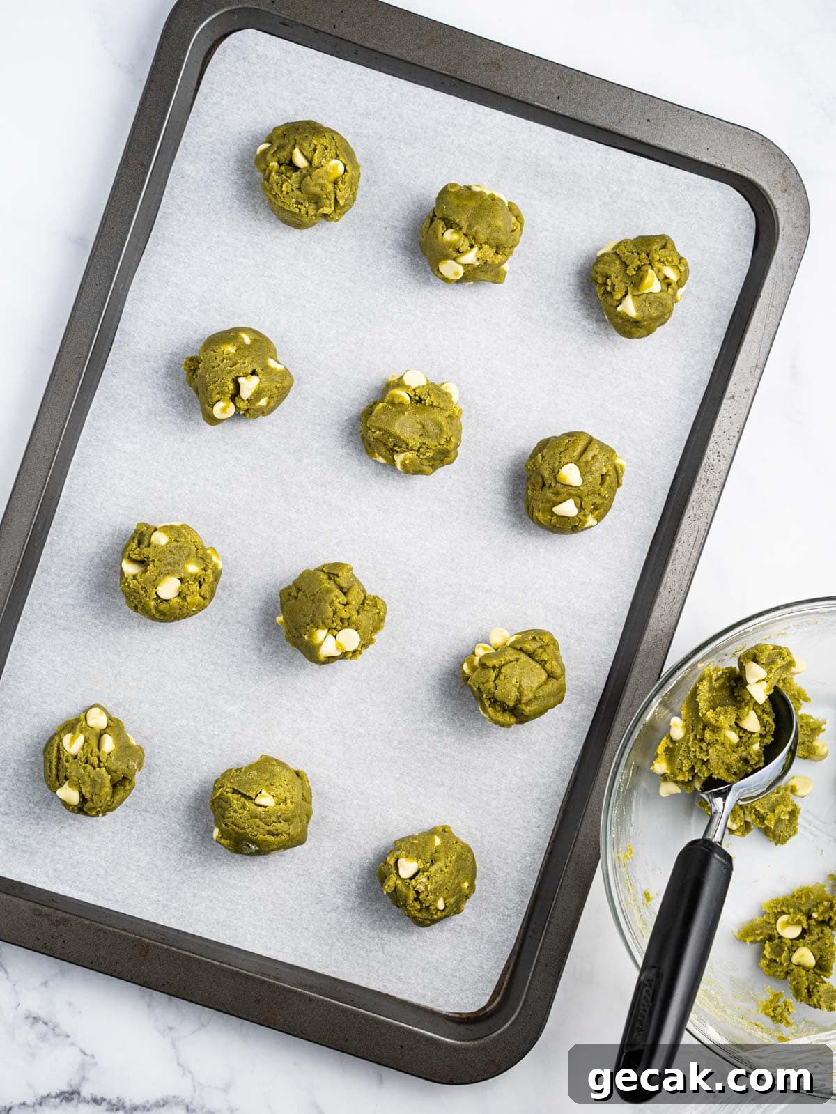 Tray of raw matcha cookie dough.