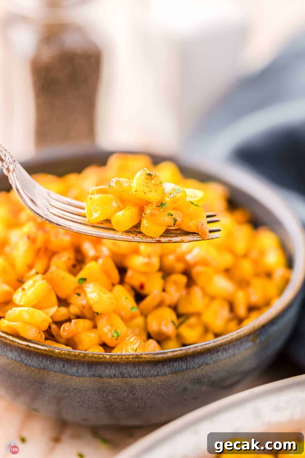 close up of fork with corn on it