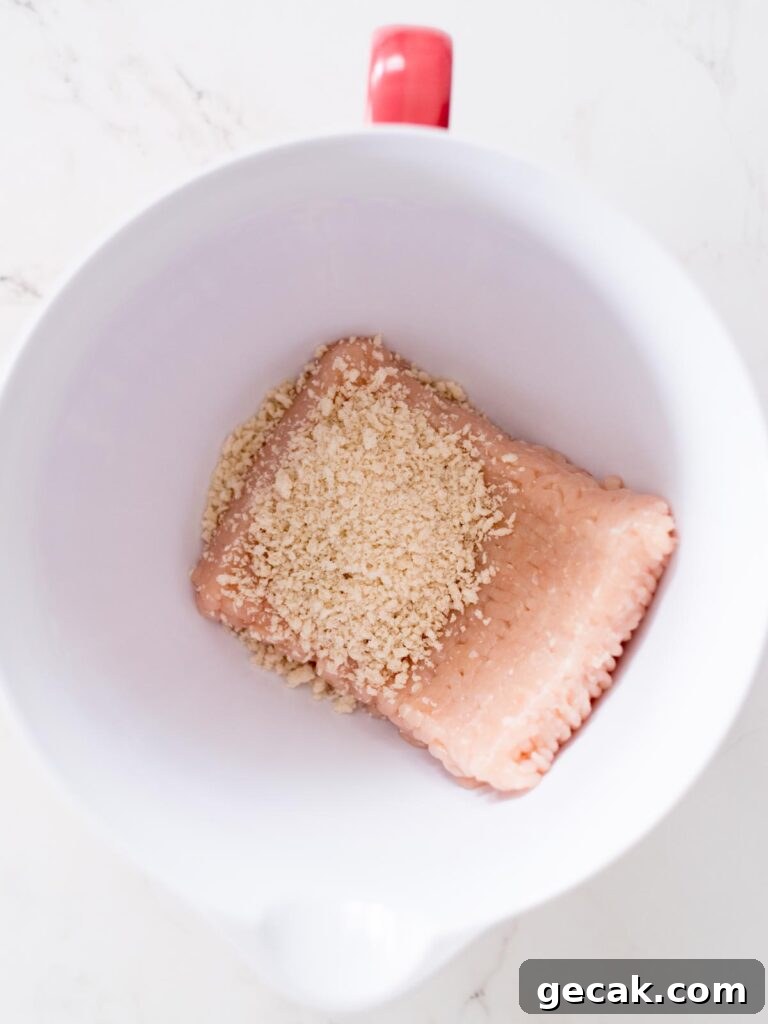 ground chicken and panko breadcrumbs in a mixing bowl