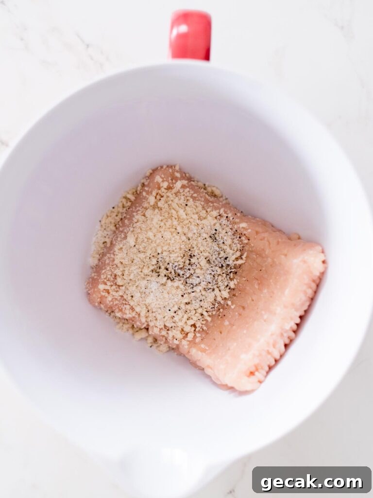 ground chicken, salt, pepper, and panko breadcrumbs in a mixing bowl