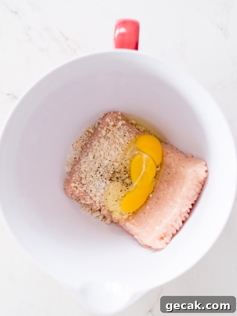 ground chicken, panko breadcrumbs, salt, pepper, and egg in a mixing bowl