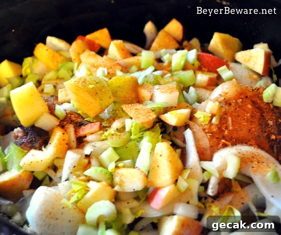The flavors of fall are melded together in these crock pot apple pork chops. As the pork chops slow cook on top of cornbread stuffing, dinner is complete.