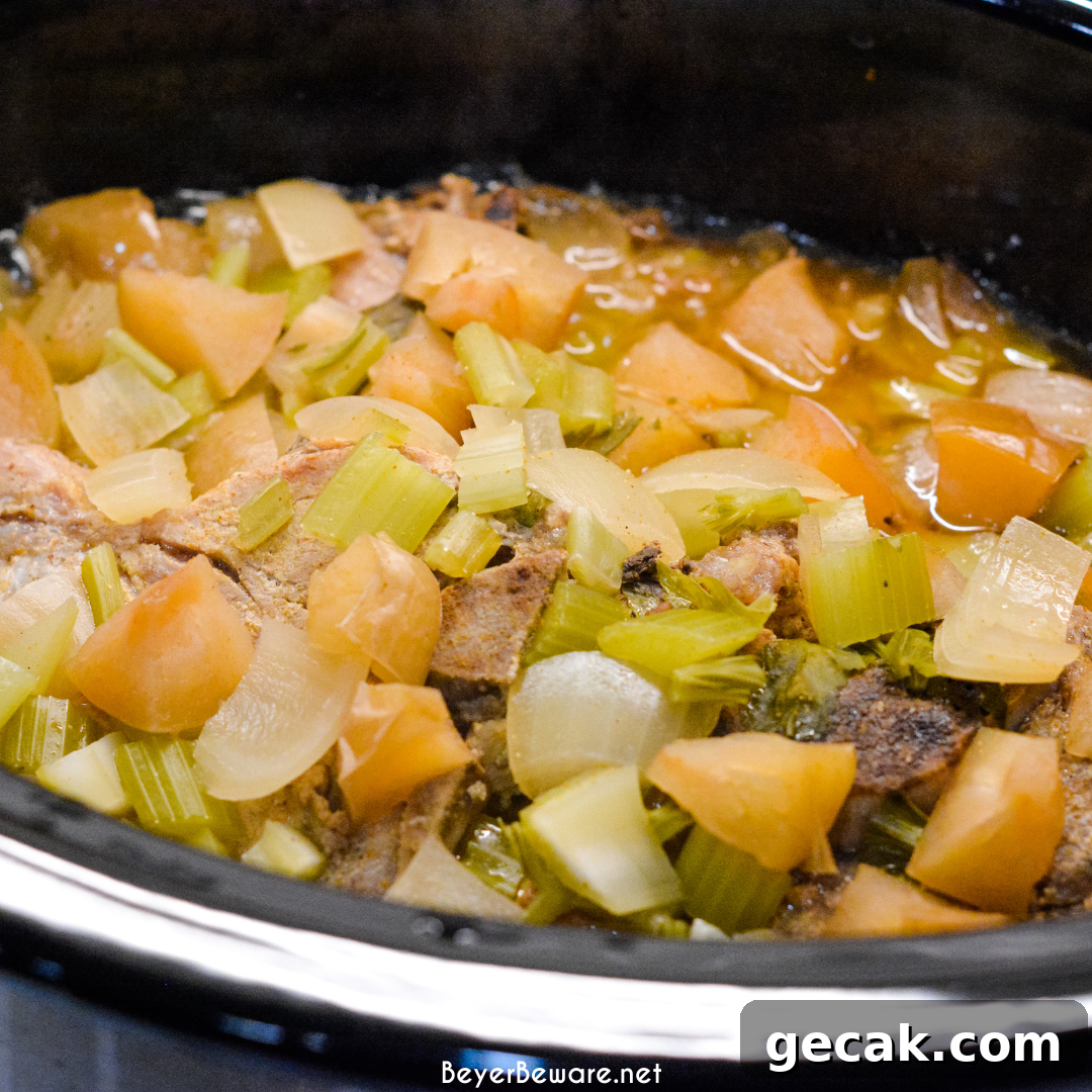 Crock pot apple pork chops is a flavorful crock pot pork chop recipe with lots of apples, onions, celery and cornbread stuffing.
