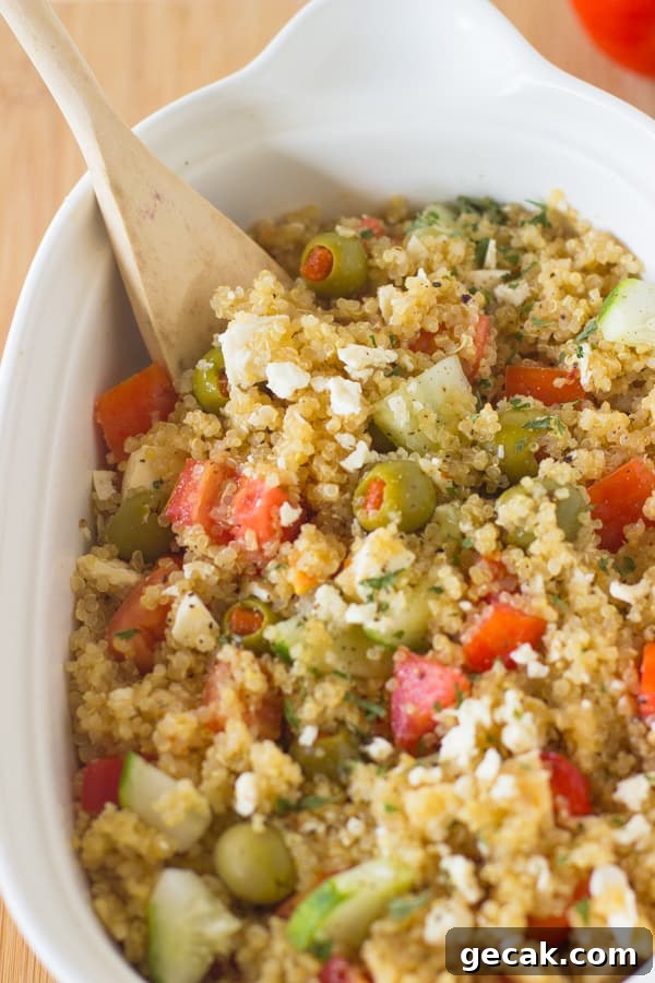 This Mediterranean Quinoa Salad is a quick and easy protein packed quinoa salad loaded with cucumbers, olives, feta cheese and delicious juicy tomatoes! It's all ready in under 30 minutes-2