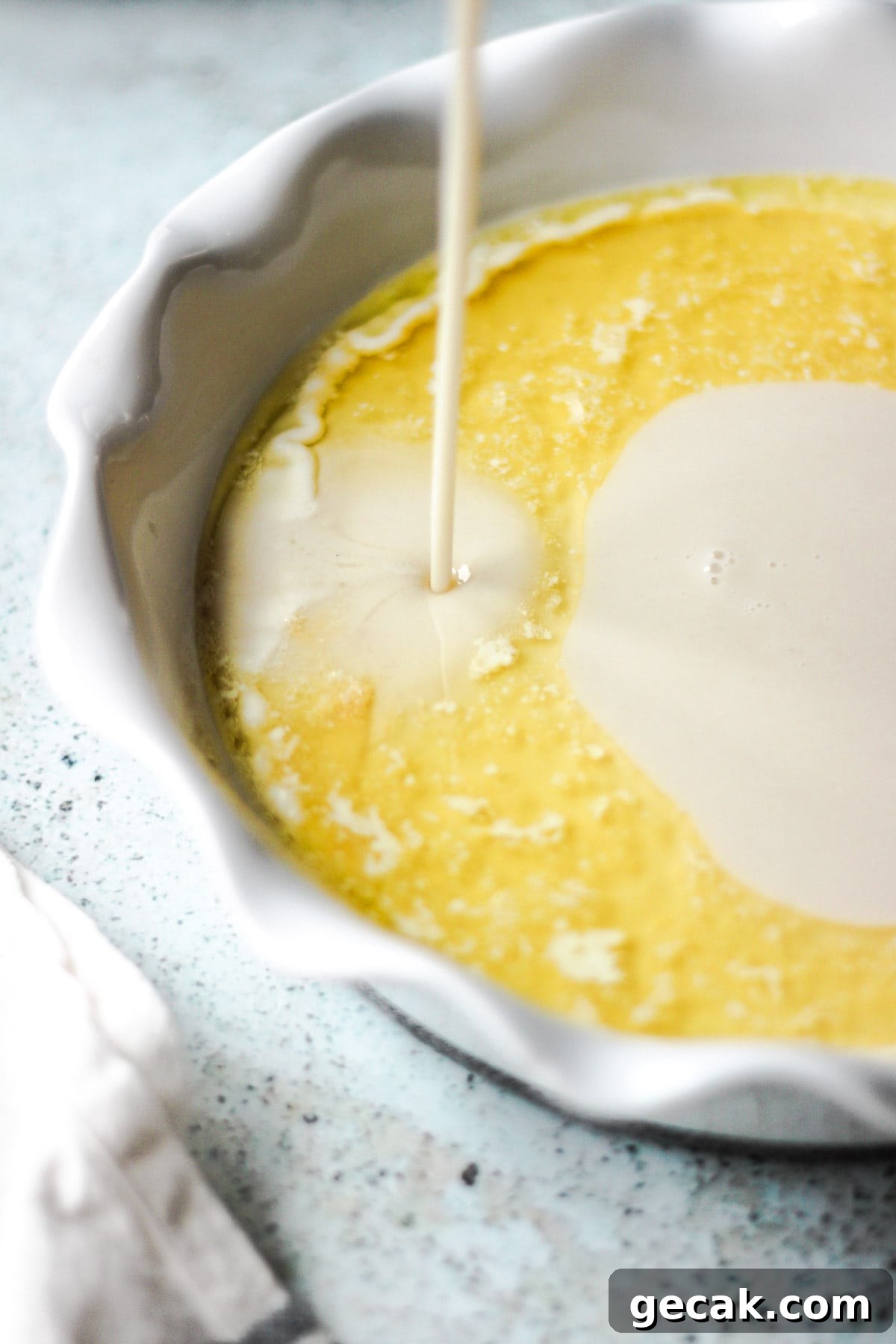 Simple Pear Cobbler Recipe with Cinnamon and Vanilla 11 Pouring batter