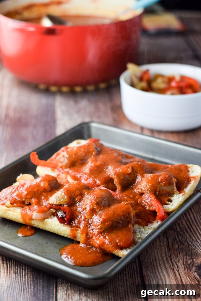 Gravy ladled on the sausage on the bread