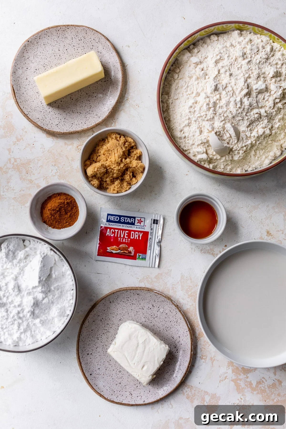 overhead view of the ingredients for vegan cinnamon rolls in individual bowls.