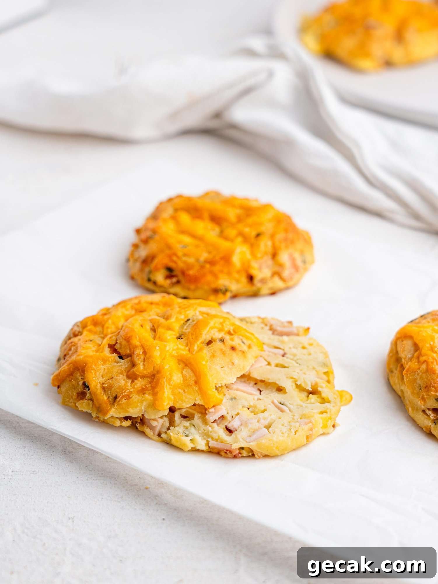 High-Protein Biscuits Without Butter — Fluffy, Low-Fat Recipe 10 A ham and cheese biscuit cut in half.
