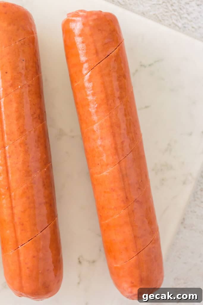 Crispy Air Fryer Hot Dogs: Quick, Juicy, and Ready in Minutes 4 Close-up of scored hot dog sausages before cooking