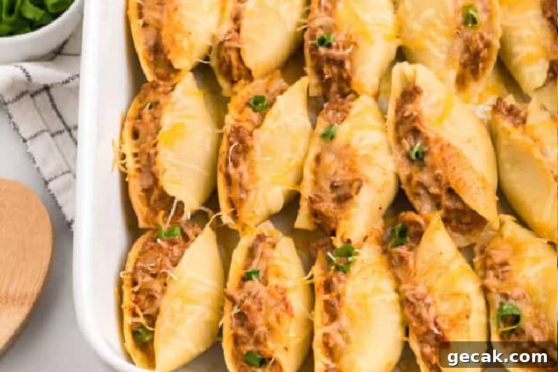 Taco Stuffed Shells in a white baking dish.
