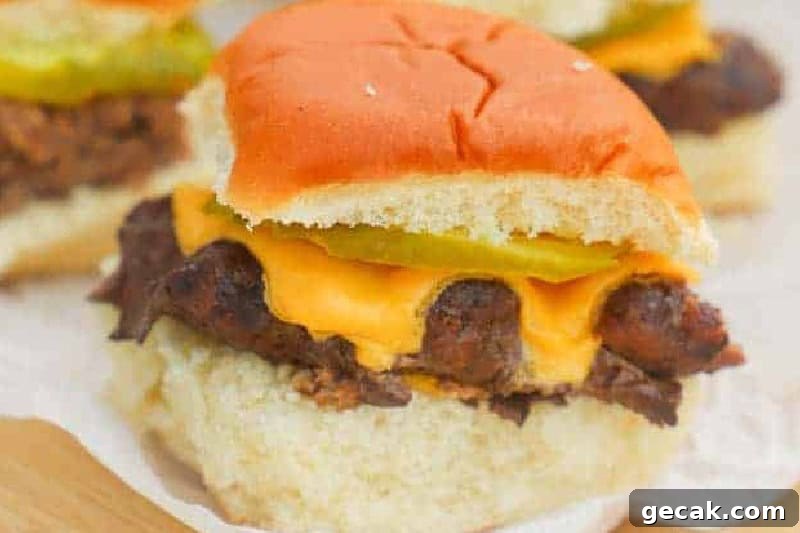 closeup of the Cheeseburger Sliders served on a wooden board.