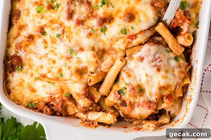 Baked Ziti served out of a white baking dish.