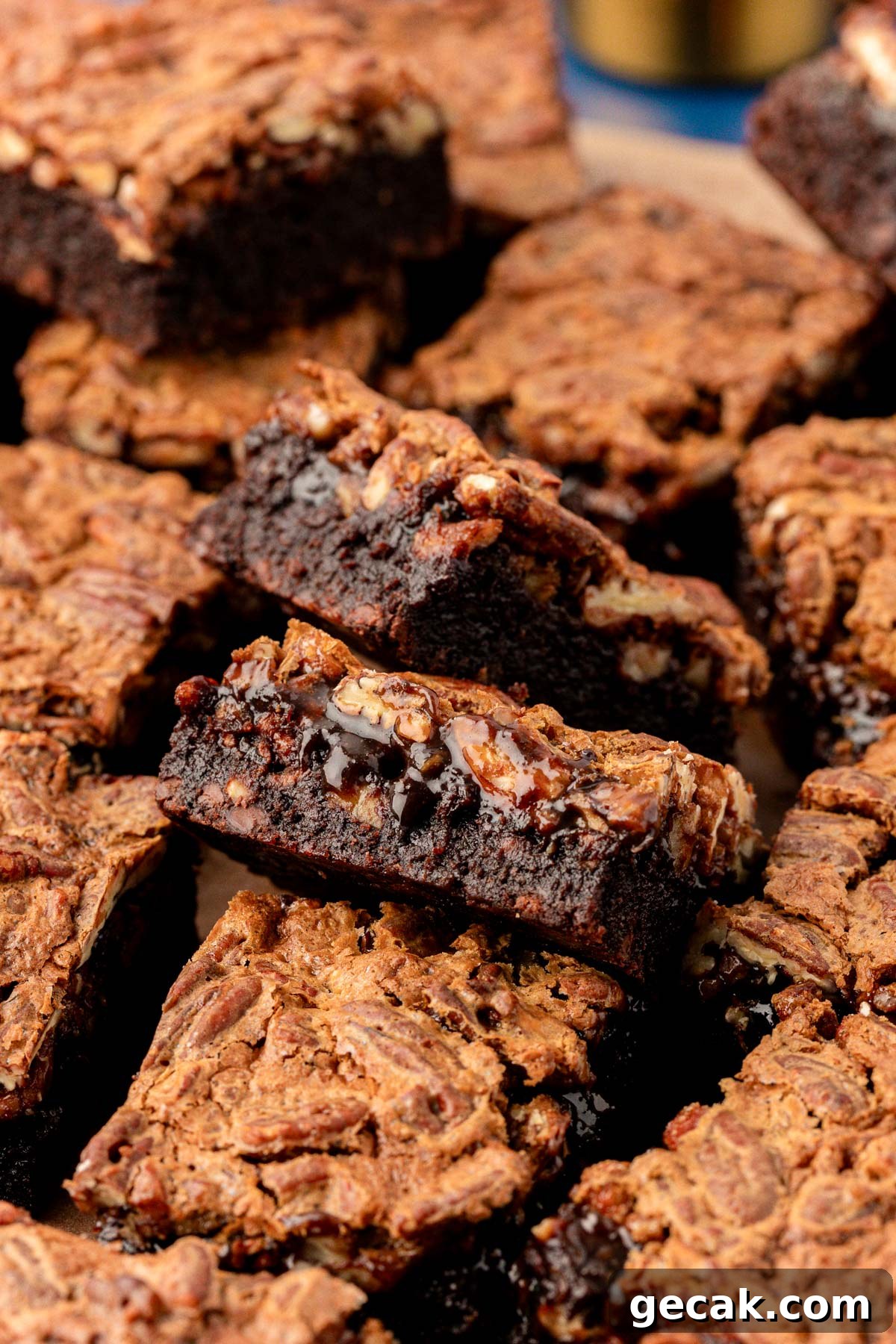 Pecan pie brownies cut up on a table.