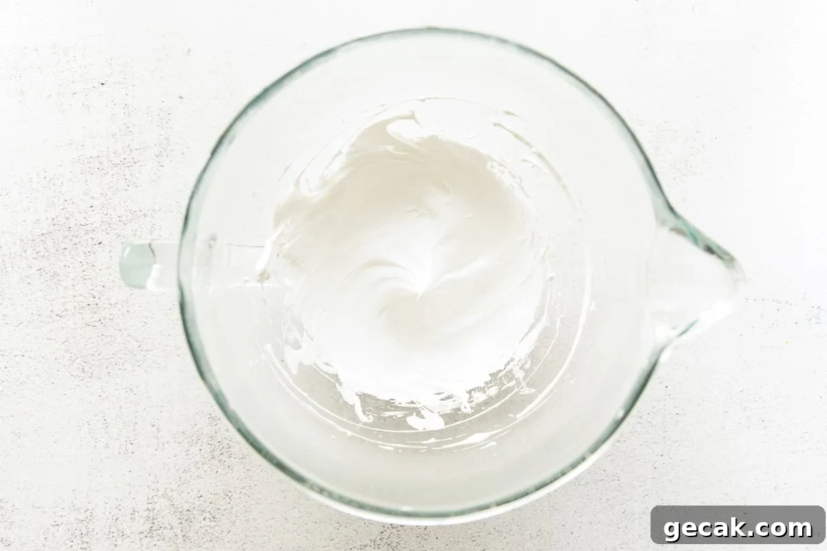 Whipped egg whites in a bowl.