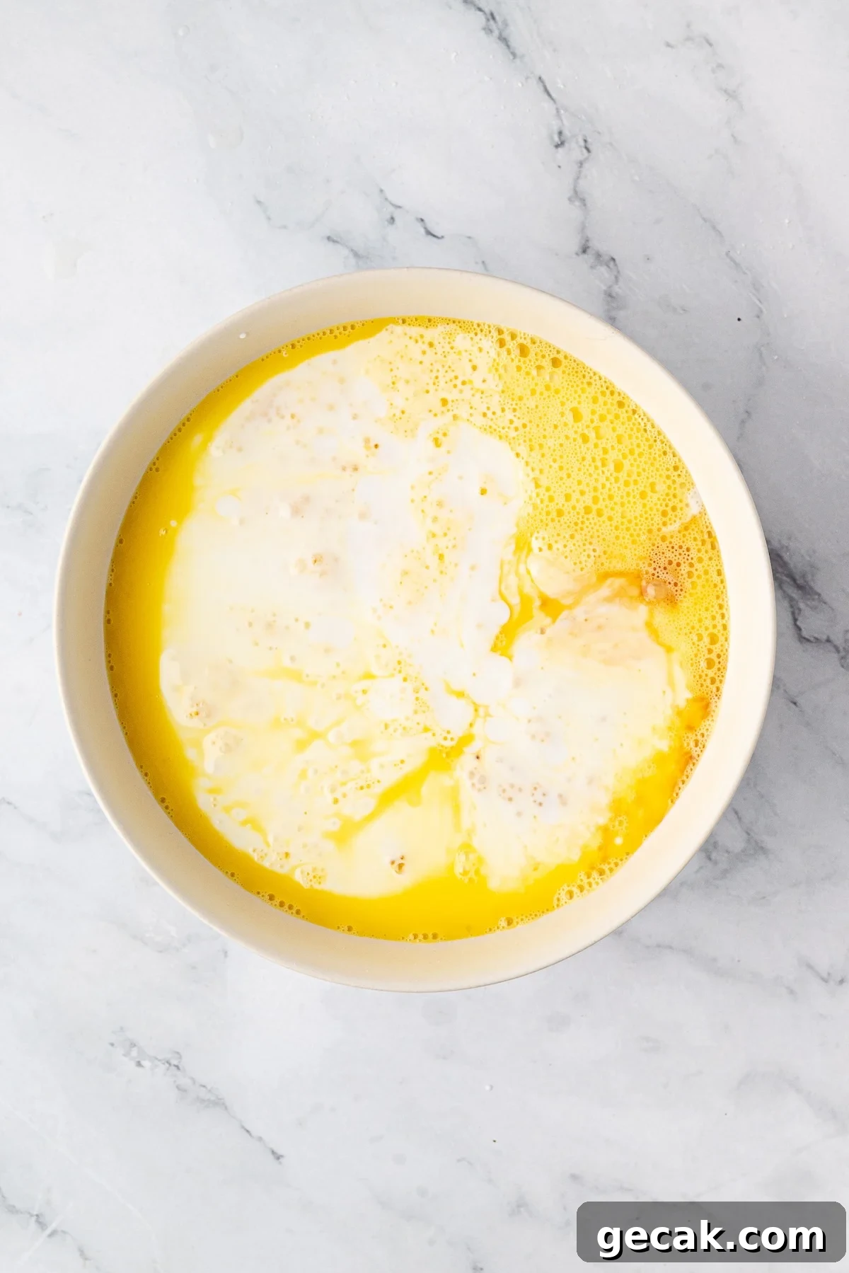 Whisked eggs, buttermilk and vanilla in a large mixing bowl.