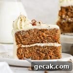a slice of gluten-free carrot layer cake on a white plate