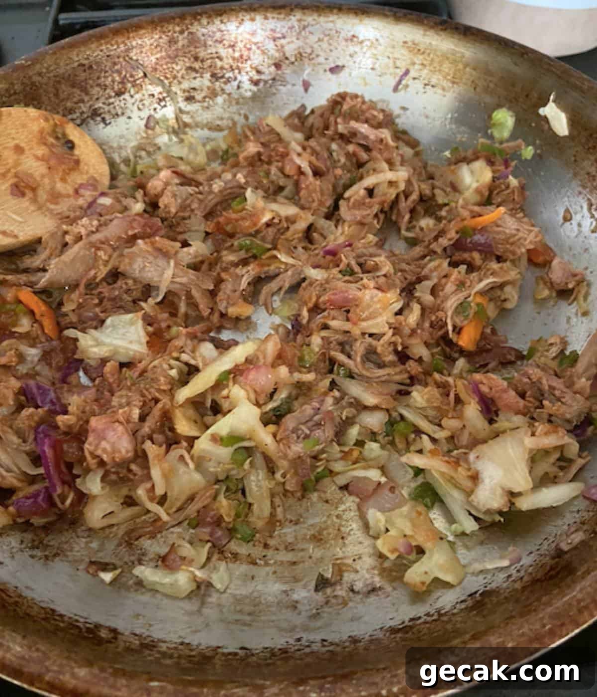 BBQ Pulled Pork Egg Rolls (Southern-Style Redneck Egg Rolls) 5 Pork filling cooking in skillet.