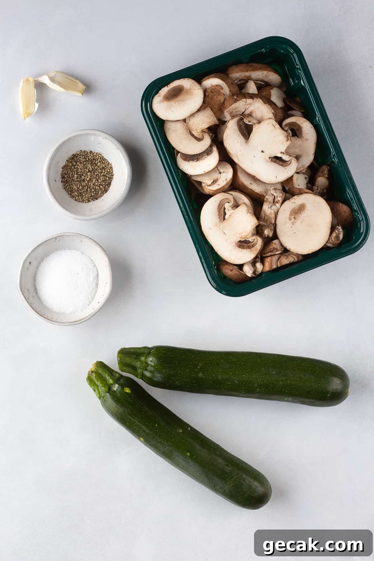 20-Minute Sautéed Zucchini and Mushrooms Recipe 3 Top down shot of ingredients for sauteed zucchini and mushrooms