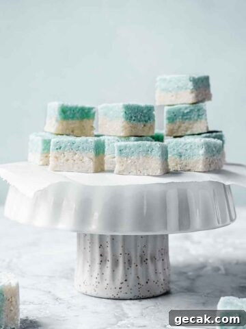 Blue and white candy squares on a white cake stand.