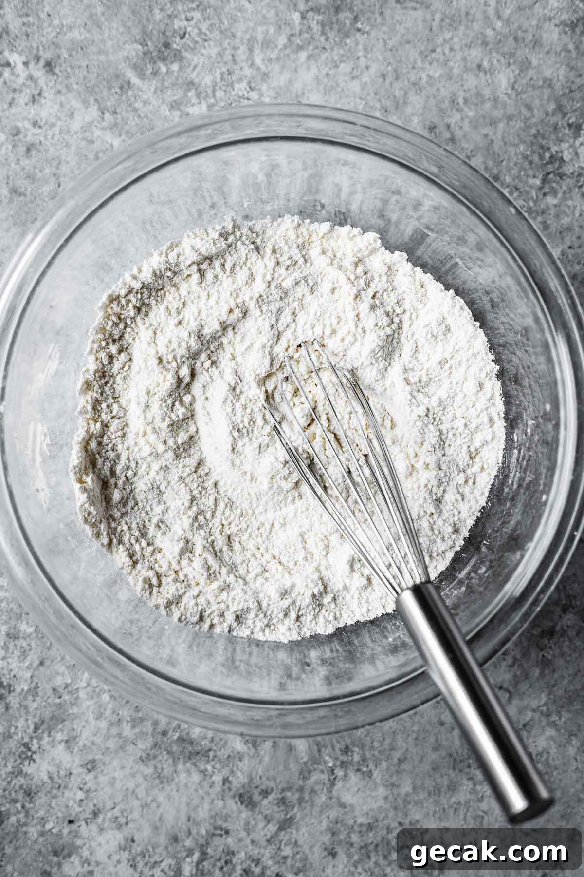 Dry ingredients whisked together in a mixing bowl.