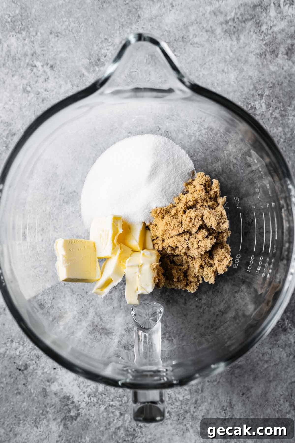 Butter and sugars in a mixing bowl.