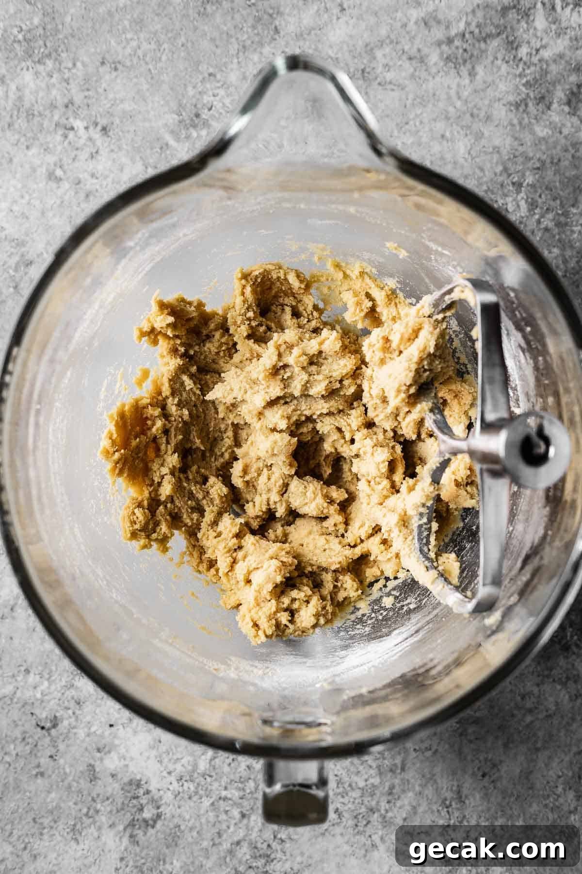 A mixing bowl of plain cookie dough without add ins.